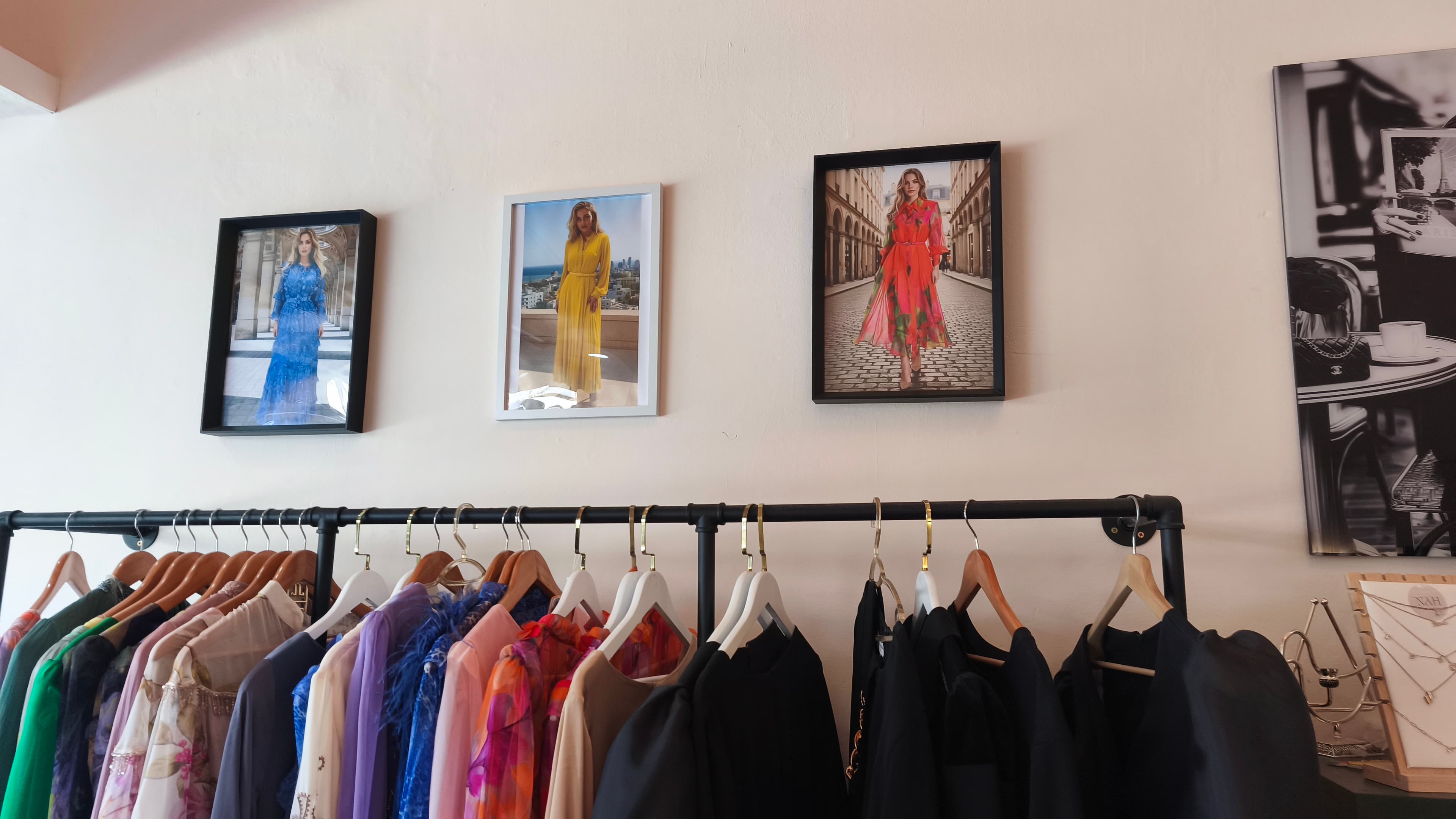 Dresses and fashion prints inside the Vol D'Oiseau boutique